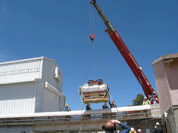 The spectrograph being placed into the observatory by a crane