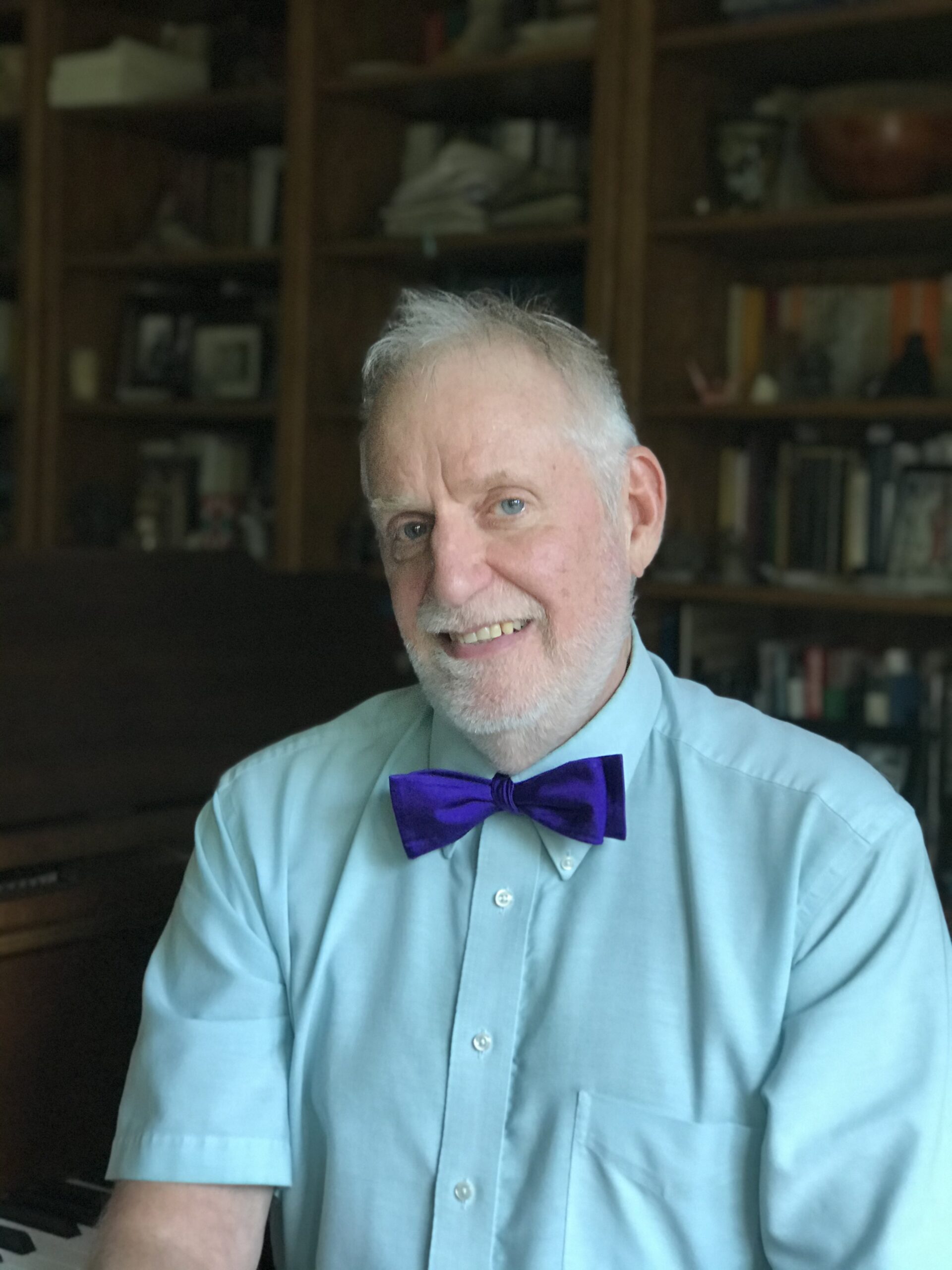 Headshot photo of Donald Schneider wearing a bowtie
